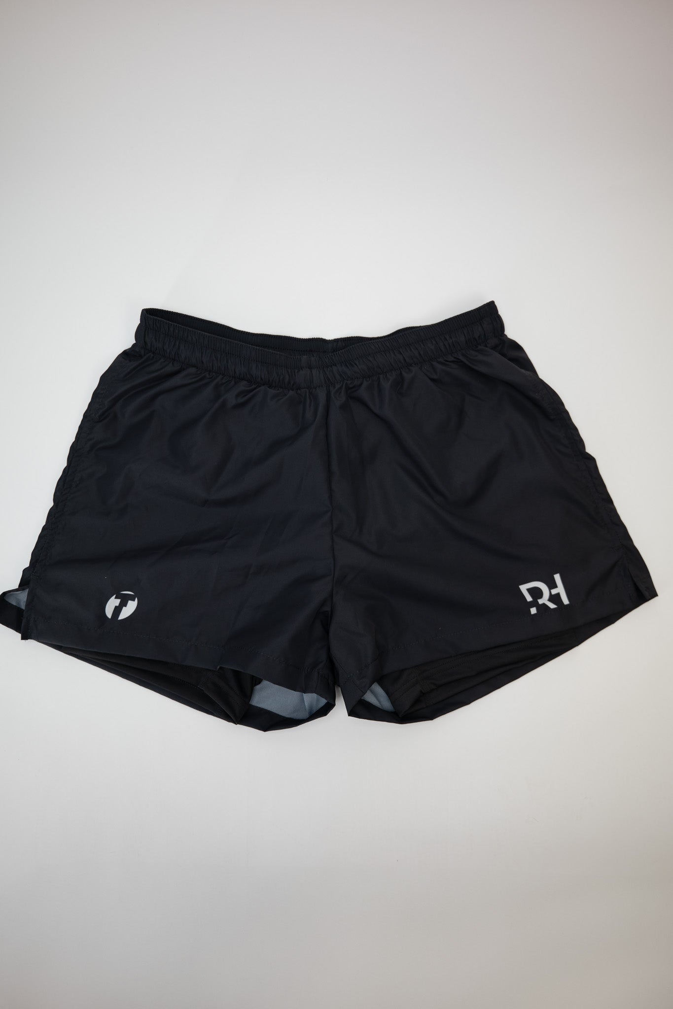 Running Shorts Fast in Schwarz von Trimtex mit weißem RH-Tri und Trimtex Logo