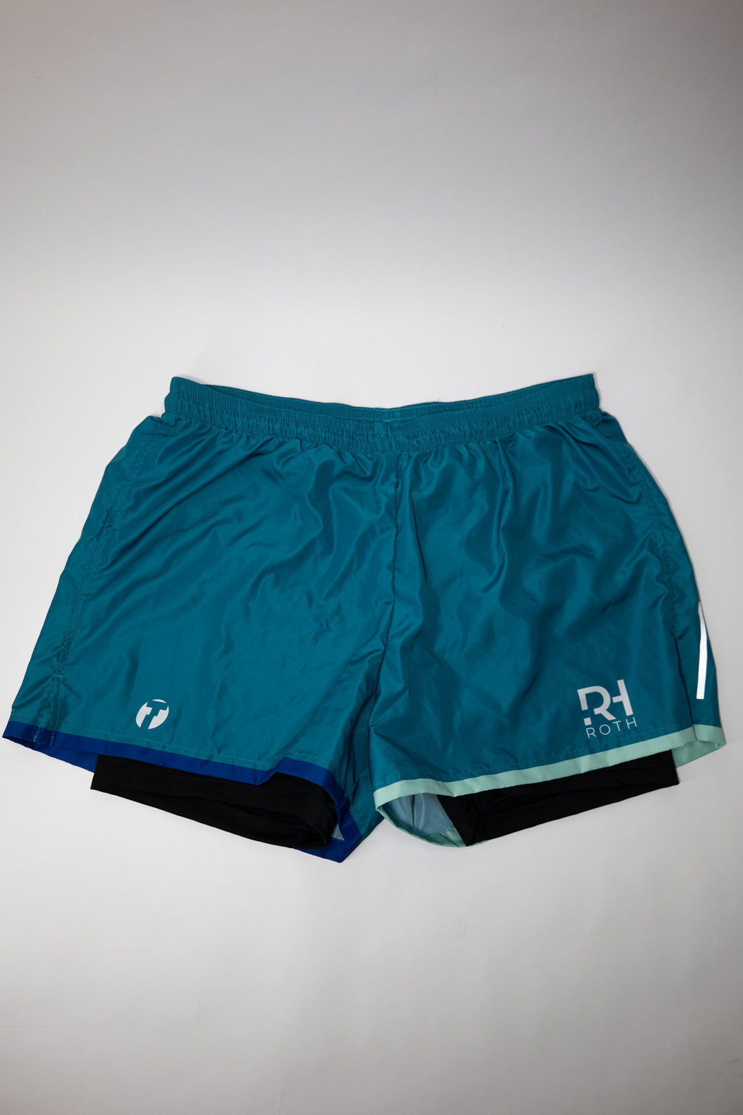 Running Shorts Fast in Turquoise von Trimtex mit weißem RH-Tri und Trimtex Logo